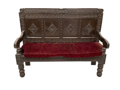 Lot 1440 - Impressive 18th century and later carved oak settle, with four lozenge panel back and solid seat on carved knopped legs, 162cm long