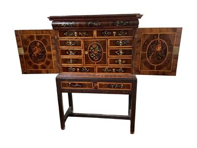 Lot 1432 - Good William & Mary walnut oyster veneered, specimen wood and green stained ivory marquetry inlaid cabinet on later stand, with cushion frieze drawer and fitted interior of drawers about centr...