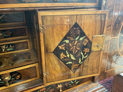 Lot 1432 - Good William & Mary walnut oyster veneered, specimen wood and green stained ivory marquetry inlaid cabinet on later stand, with cushion frieze drawer and fitted interior of drawers about centr...