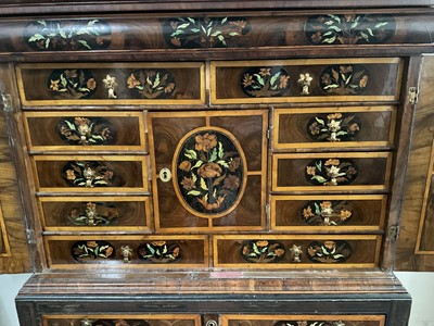 Lot 1432 - Good William & Mary walnut oyster veneered, specimen wood and green stained ivory marquetry inlaid cabinet on later stand, with cushion frieze drawer and fitted interior of drawers about centr...