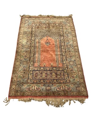Lot 1493 - Persian silk prayer rug, with central mirhab in foliate meander borders and tassel ends, 190 x 100cm