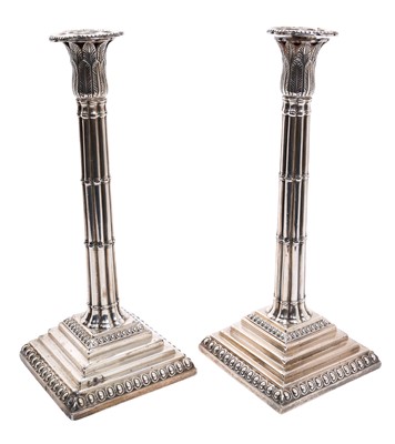 Lot 250 - Pair George III silver candlesticks with tall cluster columns and leaf decorated candle holders
