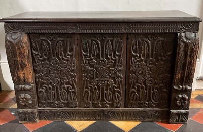 Lot 1442 - Unusual 17th century carved oak chest, of narrow proportions, with internal candle box and heavily carved front and ends, 84cm wide x 31cm deep x 50cm high