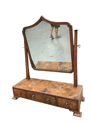 Lot 1449 - Queen Anne style walnut swing framed mirror, with arched mirror and three drawers to the base on ogee bracket feet, 60cm wide