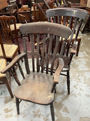Lot 5257 - Two early 20th century ash and elm slat back open armchairs