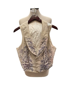 Lot 2141 - 1850s waistcoat embroidered flowers and foliage curving around each side and on shawl collar.