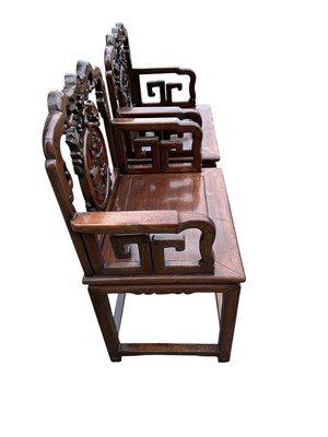 Lot 1257 - Pair of early 20th century Chinese hardwood elbow chairs