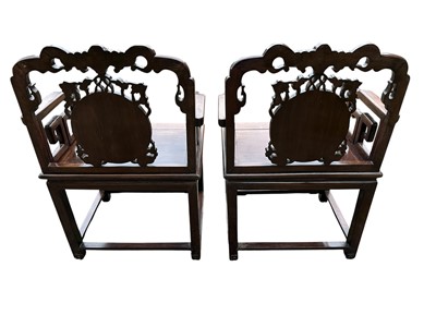 Lot 1257 - Pair of early 20th century Chinese hardwood elbow chairs