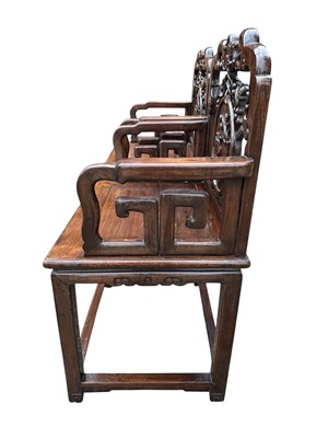Lot 1257 - Pair of early 20th century Chinese hardwood elbow chairs