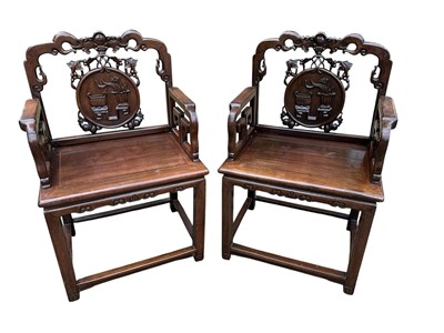Lot 1257 - Pair of early 20th century Chinese hardwood elbow chairs