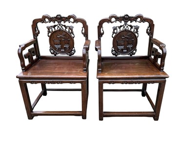 Lot 1257 - Pair of early 20th century Chinese hardwood elbow chairs