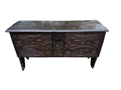 Lot 1379 - 17th century oak five plank coffer of small size, the foliate carved front panel with date for 1671, on V-formed end standards, 96.5cm wide x 32.5cm deep x 56cm high