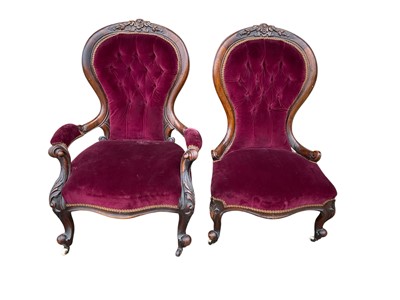 Lot 5285 - Pair of Victorian carved walnut his and hers easy chairs