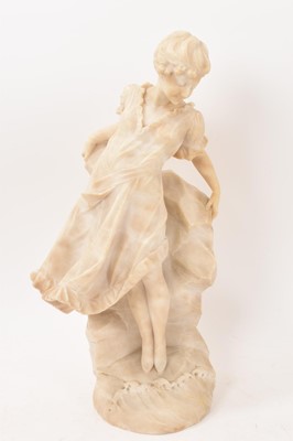 Lot 774 - Early 20th century carved alabaster figures of a young girl amongst rocks, 44cm high