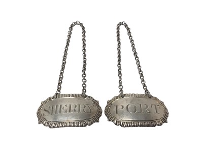Lot 277 - Pair George III silver decanter labels of shaped form, with gadrooned borders and suspension chains