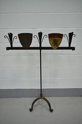 Lot 1425 - Mediaeval revival wrought iron candle stand, with polychrome shields on tripod scrolled supports, 91cm wide x 137cm high