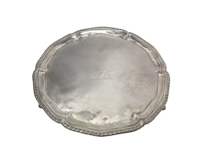 Lot 284 - George III silver salver of hexagonal form, with engraved armorial crest and gadrooned border