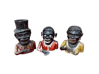 Lot 2500 - Three figural cast iron money boxes