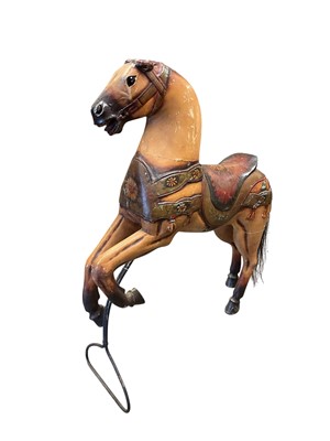 Lot 1457 - A Victorian style painted fairground galloper horse, with glass eyes and painted ornament on metal stand, by repute from a roundabout - 'Ride of savage horses' 96cm long
