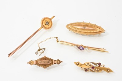 Lot 461 - Group of five Victorian and Edwardian gold brooches to include an Edwardian 15ct ruby and diamond brooch (Chester 1902)