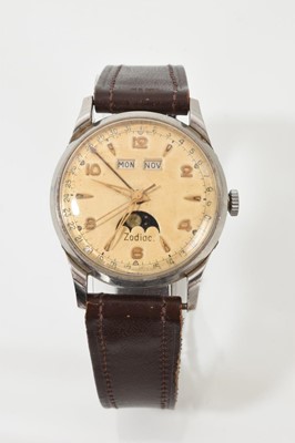 Lot 554 - Gentlemen's Zodiac moon phase wristwatch with a manual wind movement numbered 1100 in a stainless steel case numbered 905, serial number 337134 with a cream dial and a date hand, on a brown leat...