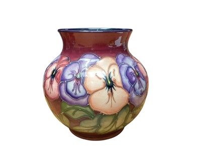 Lot 1107 - Moorcroft pottery vase decorated in the Pansy pattern, 14.5cm high