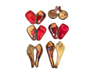 Lot 2424 - Collection of meerschaum pipes, mostly antiques, including one in the form of a woman's leg, another with a scantily clad woman, etc, mostly cased (17)