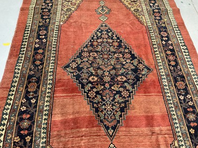 Lot 1496 - Sultanabad rug, with central diamond medallion on brick red ground, 340 x 174cm