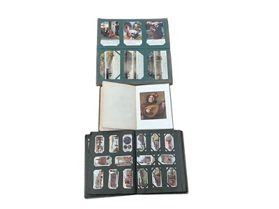 Lot 1458 - Early 20th century postcard album containing a quantity of First World War interest cards, together with a cigarette card album and book- Franz Hals, Masterpieces in colour (3).