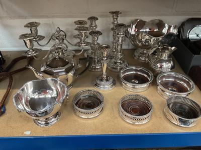 Lot 56 - Group of silver plated items to include candlesticks, punch bowl and teapot.