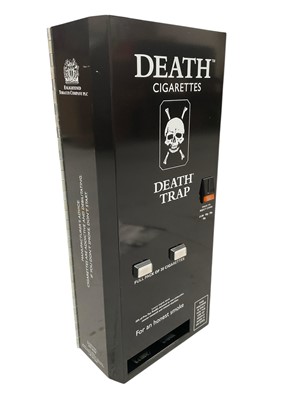 Lot 2459 - 1980s advertising Death Trap cigarette dispenser machine for Death Cigarettes, together with three Death comics