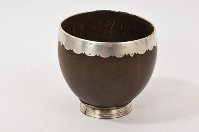 Lot 668 - 19th century coconut cup with white metal mounts