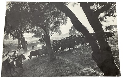 Lot 1434 - Gordon Parks, American, 1912-2006. South American cattle herders, c.1960, gelatin silver print, signed by Gordon Parks to verso and red ink Toni Parks (UK) Collection stamp to verso. 22cm x 33cm...