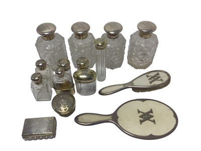 Lot 346 - Collection of Victorian silver-mounted scent bottles, vanity jars and other dressing table pieces, retailed by Asprey, (various dates and makers).