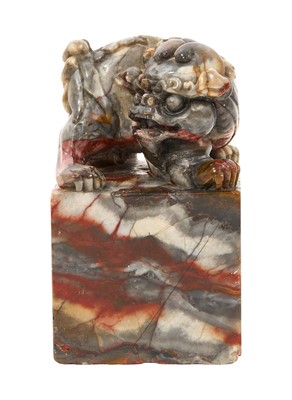 Lot 669 - Chinese large carved soapstone seal or ink stone, the finely carved Dog of Foo surmounting a heavy square base, the underside carved with seal matrix.