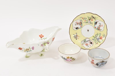 Lot 19 - 18th century Meissen double lipped sauceboat with twin handles and floral decoration, crossed swords mark, 23.25cm wide, together with two Meissen tea bowls and a yellow ground Meissen saucer, d...