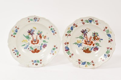 Lot 23 - A pair of Doccia plates, c.1775, richly decorated with the Tulipano pattern, the central design within six further floral sprays, 23.7cm.