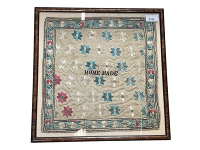 Lot 2106 - Charming 19th century silk needlework sampler cloth, “Home Made”, the blue, cream and dark pink flowers arranged in a pattern on a cream ground, all within in a floral and leafy border. Framed