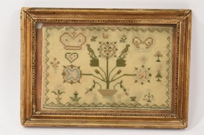 Lot 678 - 18th century needlework sampler, probably for the marriage King George III and Queen Charlotte in 1761. The crowns of both monarchs either side of a three-flowered plant, parrots perched, other...