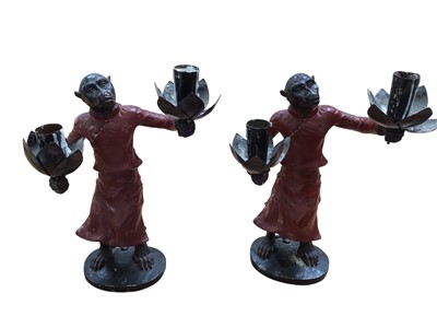 Lot 5108 - Pair of monkey two-branch candlesticks, the monkeys with outstretched arms holding sconces for candles