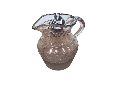 Lot 5155 - Late 18th century Irish cut glass jug, cut decoration with a scalloped rim and applied loop handle, a kick-in base with rough pontil