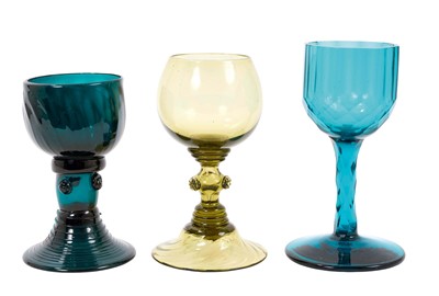 Lot 46 - English Bristol Green Roemer style wine glass, one other pale green example of a Roemer type wine glass, and a Victorian ‘Peacock Blue’ wine glass with cut decoration. (3 pieces)