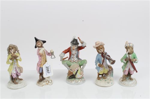 Lot 2087 - Five piece porcelain 'monkey band' - some with...
