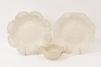 Lot 12 - Two mid 18th English salt glazed plates and a sauce boat (3)