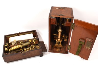 Lot 710 - Early 19th century brass microscope with fittings, in mahogany box, together with an early 20th century brass microscope by Ross of London, with military broad arrow mark, in mahogany case (2)