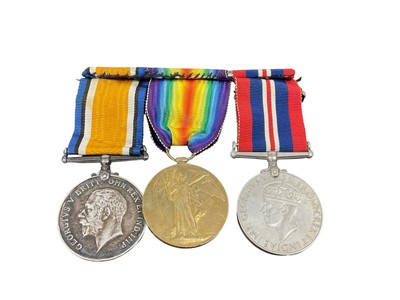 Lot 702 - First World War and later trio comprising War and Victory medals named to 5767 PTE. G. R. Parker. Norf. R. and a Second World War War medal (mounted on bar).