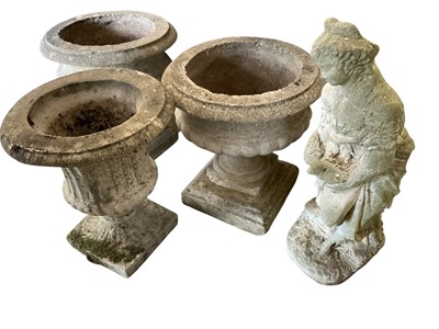 Lot 1472 - A pair of weathered concrete garden urn, another similar and a figure of a lady.