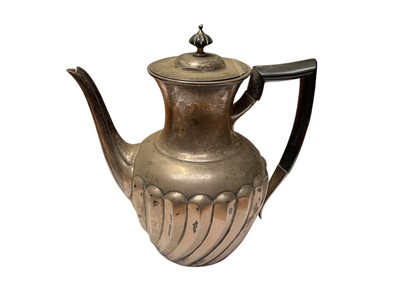 Lot 103 - Victorian silver coffee pot of baluster form with wrythen decoration, hinged lid and ebonised handle, (London 1894), maker William Hutton & Sons, 21cm in overall height, all at approximately 20ozs.