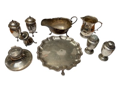 Lot 107 - Collection of silver items to include Edwardian silver waiter of circular form with pie crust border, (London 1906), salver, silver sauce boat cruet set and other items, (various dates and makers)
