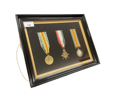 Lot 748 - First World War 1914 - 15 Star trio, comprising 1914 - 15 Star, War and Victory medals named to 1541 PTE. E. A. Leslie. Linc. Yeo, nicely mounted in an ebonised wood frame with labels verso.
